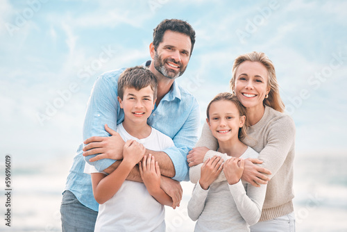 No work for mom and dad. Shot of a beautiful family bonding while spending a day at the beach together.