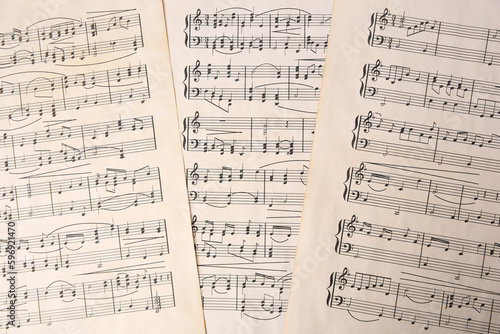 Sheets of paper with different notes as background, top view