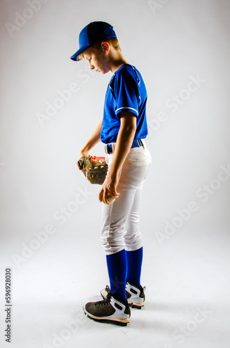 Photography Sad young baseball player head down depressed after losing a game