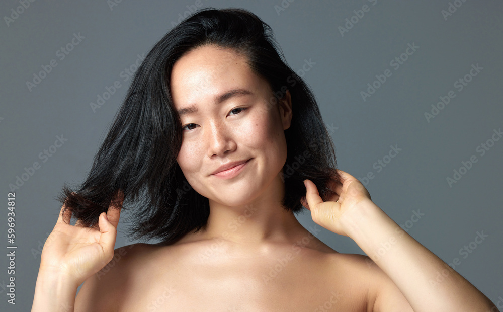 Finding the right product makes a big difference. Studio shot of a beautiful young woman posing against a grey background. Finding the right product makes a big difference. Studio shot of a beautiful young woman posing against a grey background.