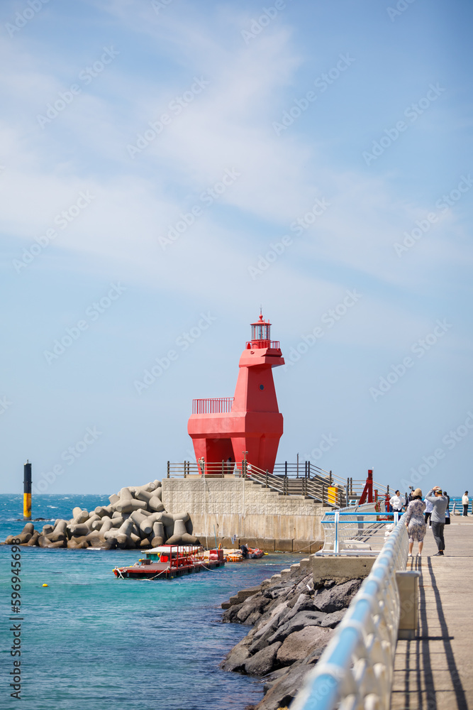 Wonderful Iho Tewoo Beach two horse shaped lighthouses. Jeju Island, South Korea