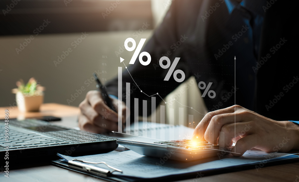 Interest rate and dividend concept, Businessman is calculating income and return on investment in percentage. income, return, retirement, compensation fund, investment, dividend tax, stock market - obrazy, fototapety, plakaty 