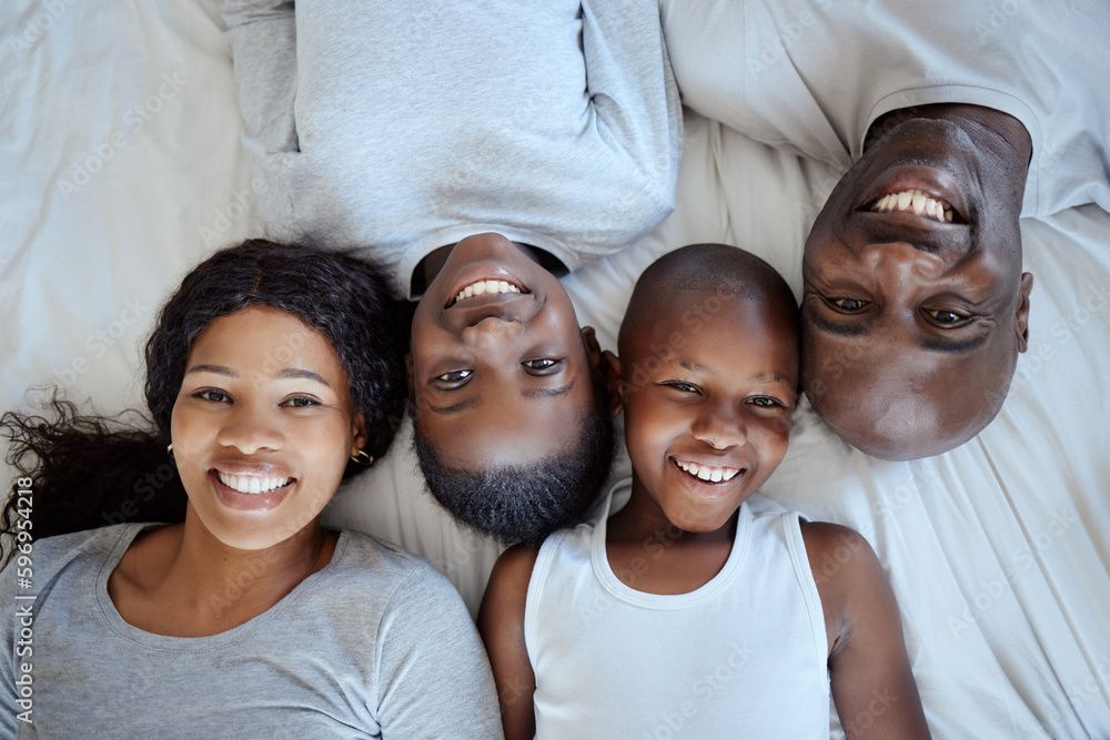 A happy family is but an earlier heaven. Shot of a beautiful young family bonding in bed together. A happy family is but an earlier heaven. Shot of a beautiful young family bonding in bed together.