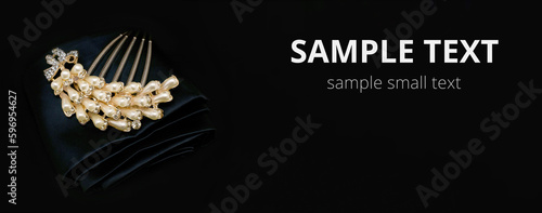 Golden jewelry with gemstone , mockup for copy space and design. Isolated on black cloth background
