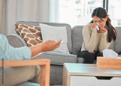 Therapy helps us to deal with our emotions. Shot of a young woman crying during a consultation with her therapist.