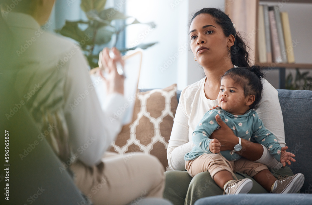 This is a normal reaction. Shot of an attractive young woman sitting with her daughter during a consultation with a psychologist. This is a normal reaction. Shot of an attractive young woman sitting with her daughter during a consultation with a psychologist.