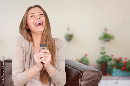 Free time. Young girl checking networks on phone