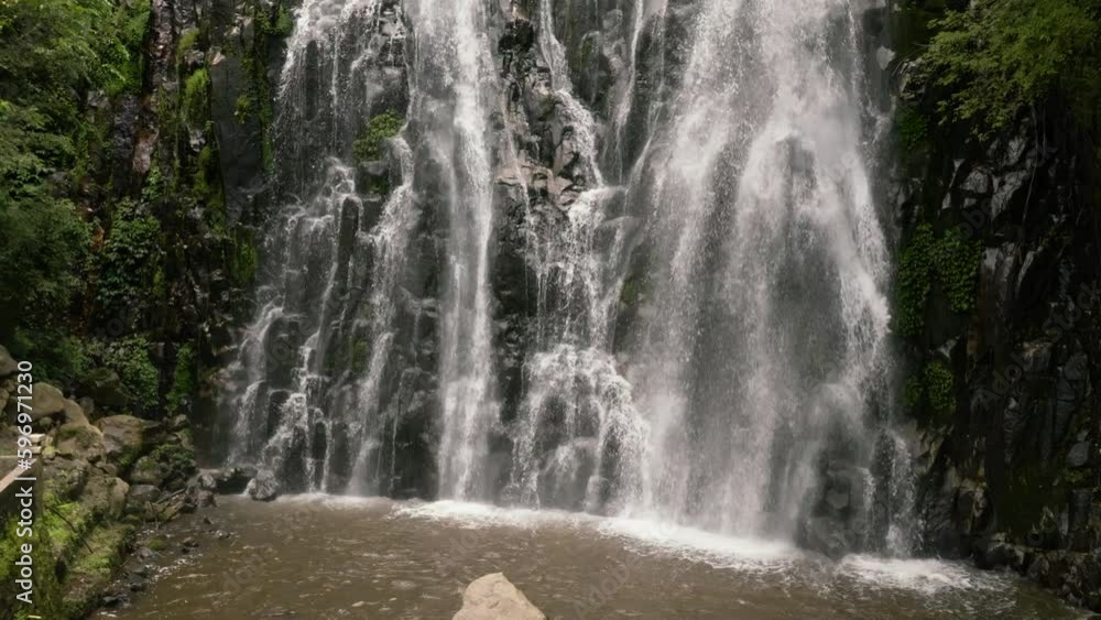 Jungle Waterfall in a tropical forest in slow motion. Efrata Falls. Sumatra, Indonesia. Jungle Waterfall in a tropical forest in slow motion. Efrata Falls. Sumatra, Indonesia.