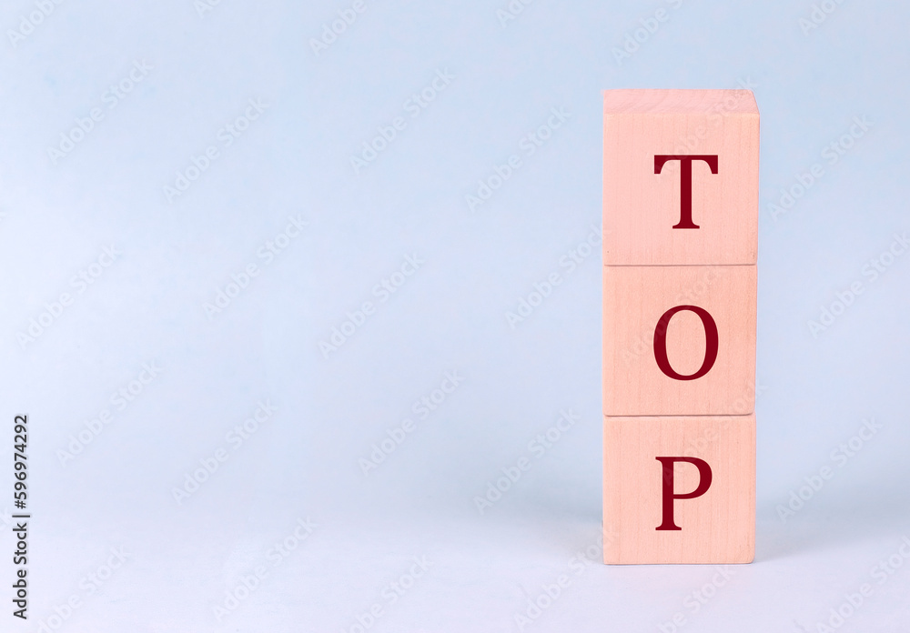 TOP on wooden cubes on a blue background TOP on wooden cubes on a blue background