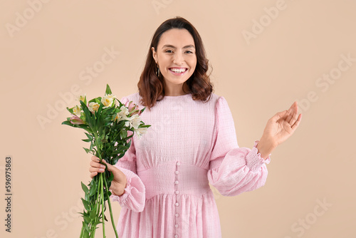 Young woman in pink dress w...