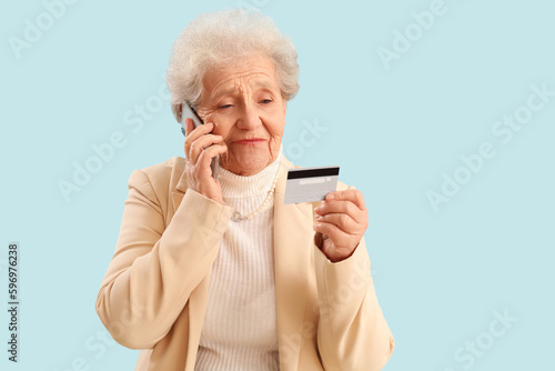 Senior woman with credit ca...