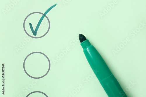 Checklist box with green ma...