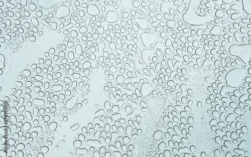 drops of water on the sunroof of a car