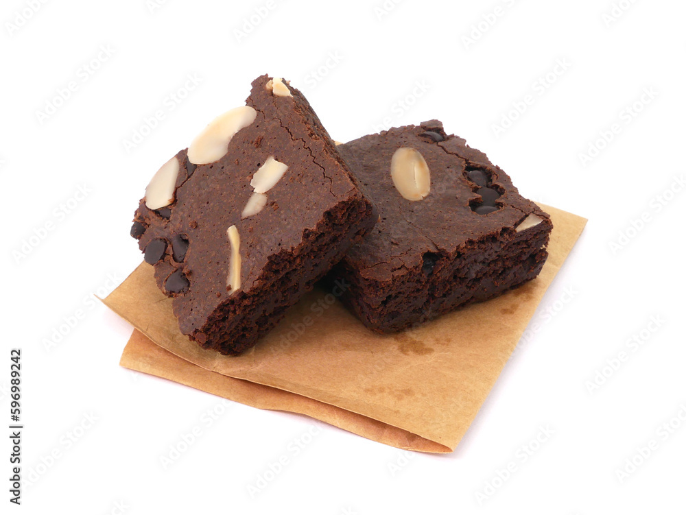 Brownies on paper isolated white background. Chocolate brownie with sliced almond nuts toppings. Chocolate Brownie pieces. selective focus. Brownies on paper isolated white background. Chocolate brownie with sliced almond nuts toppings. Chocolate Brownie pieces. selective focus.