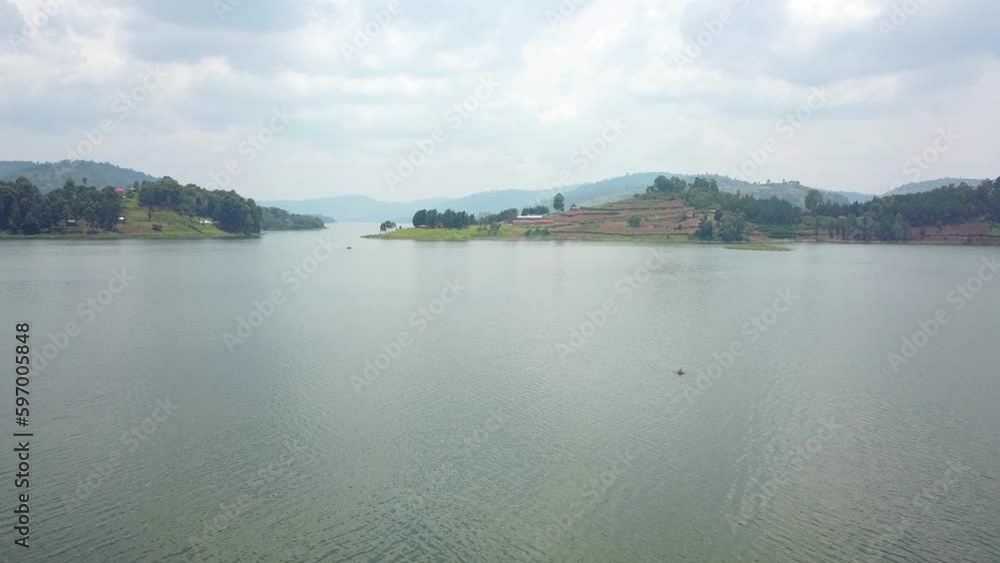 Calm Waters Of Lake Bunyonyi In Uganda, Africa - aerial drone shot Calm Waters Of Lake Bunyonyi In Uganda, Africa - aerial drone shot