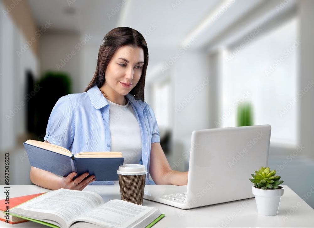 Young business female employee working in office Young business female employee working in office
