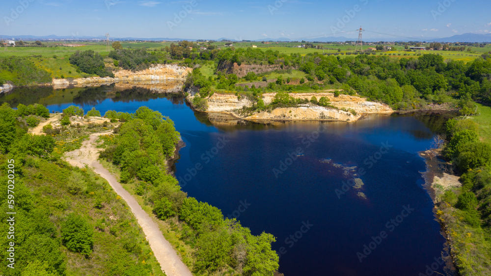 Aerial view of the Lovers Lake. The Lago degli Innamorati is located in Pomezia solfatara, in the Metropolitan City of Rome, Italy. It is part of a volcanic area.