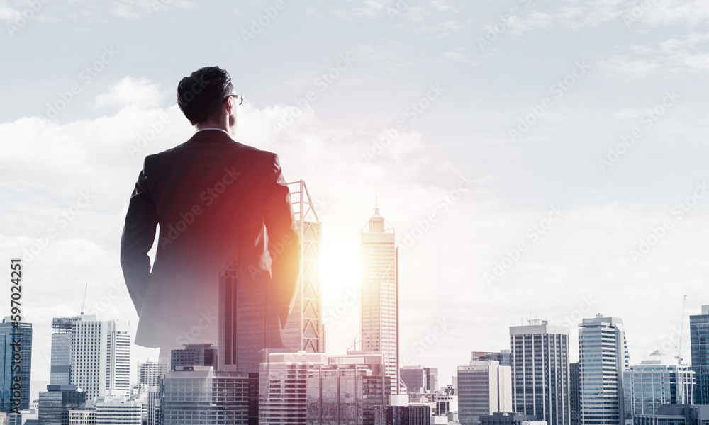 Concept of business success and control with confident boss against cityscape background