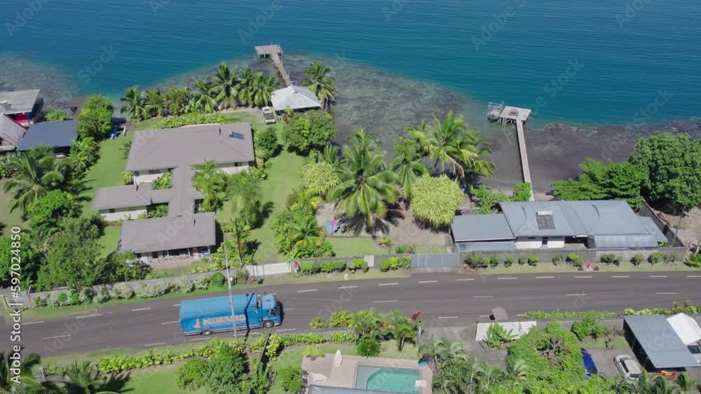 Aerial View of Road and Beachfront Properties in Tahiti and the Coral