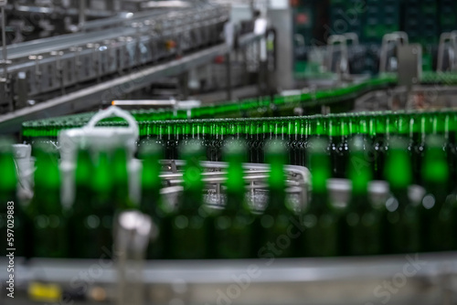 Beer bottles on a production line in a brewery. Selective focus