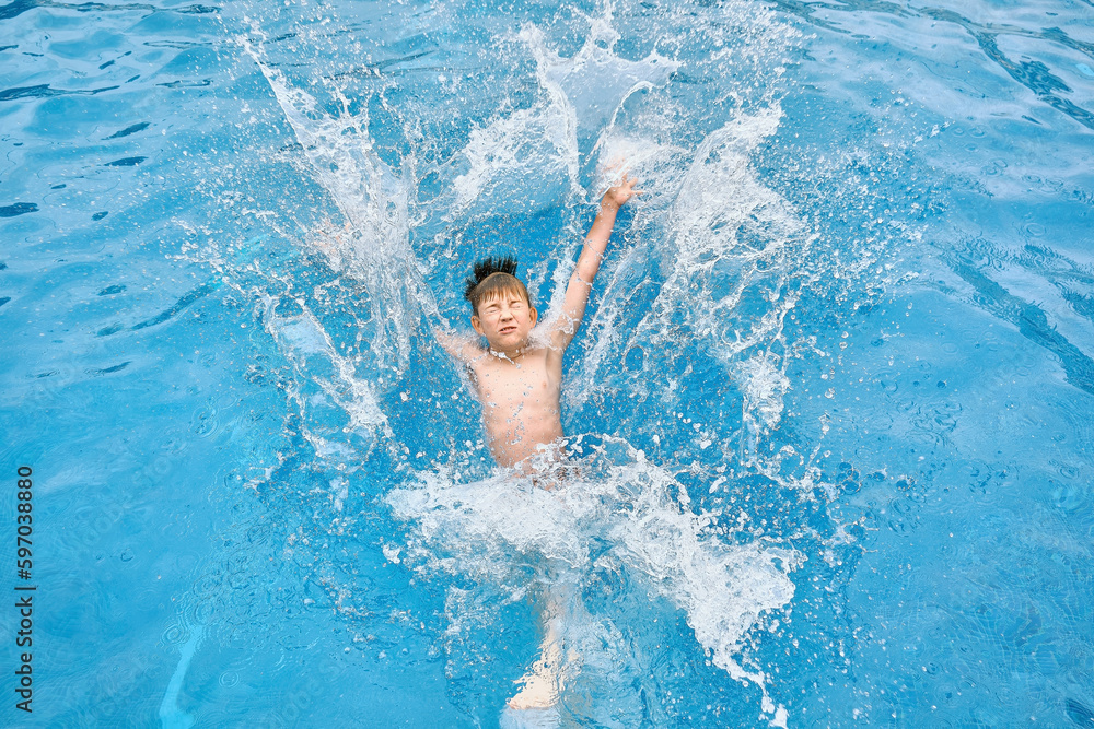 Child jump, swim in the pool, sunbathes, swimming in hot summer