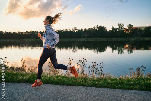 Woman running outdoors. Healthy lifestyle concept, people go in sports. Silhouette family at sunset. Health care, authenticity, sense of balance and calmness.
