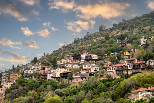 View of the old city of Alanya and the castle walls at sunset © yalcinsonat