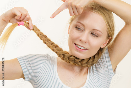 Blonde young woman with braid hair
