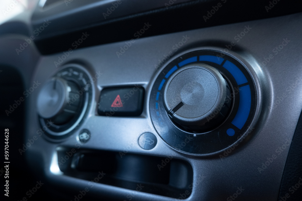 selectively focus on the air conditioner (AC) control panel on the car dashboard. soft focus. under exposure selectively focus on the air conditioner (AC) control panel on the car dashboard. soft focus. under exposure