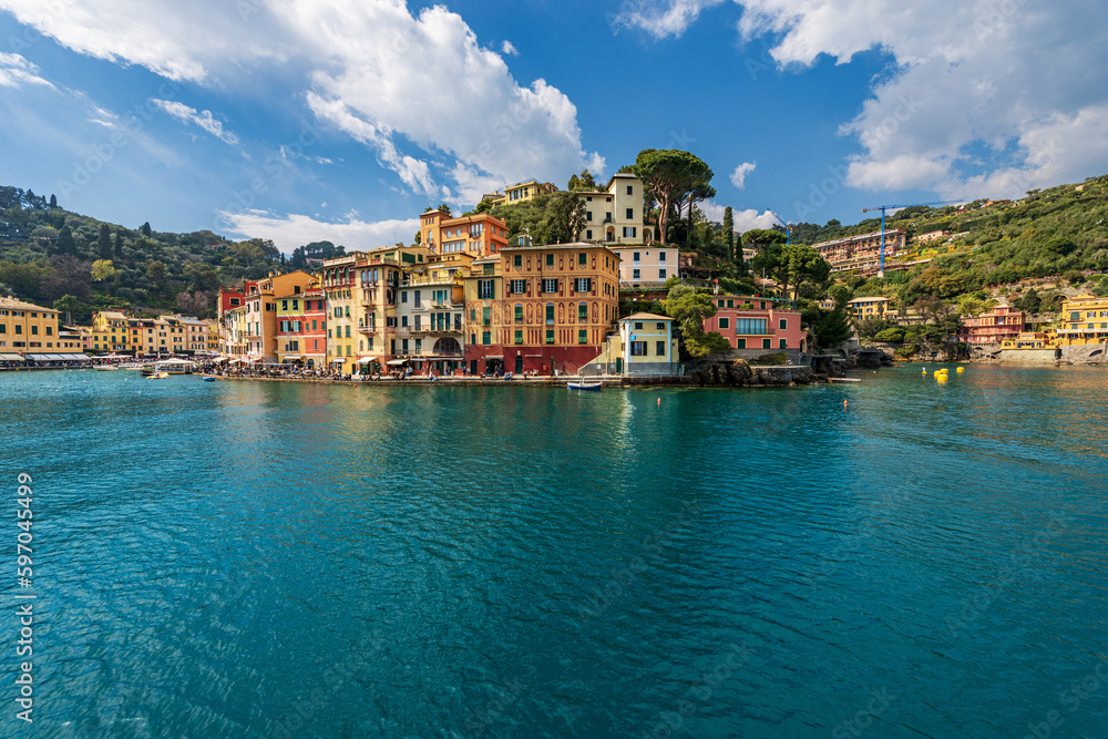 Port of the famous village of Portofino, luxury tourist resort in Genoa Province, Liguria, Italy, Europe. Colorful houses, Mediterranean sea (Ligurian sea).