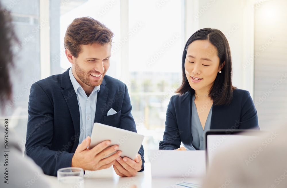Business people, meeting conversation and tablet ideas together in an office. Asian woman employee reading a report review with a businessman while talking and planning a company strategy with data