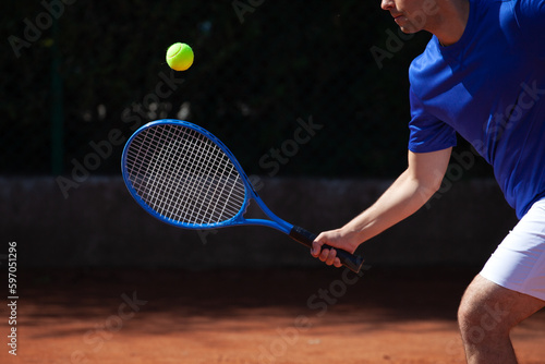 Tennis Player Meets a Ball Hit © omphoto