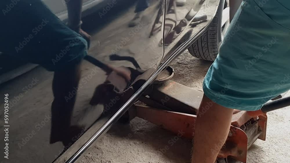 Mechanic auto shop hydraulic lifting car with jacks to check tyre tire for maintainance and repair Mechanic auto shop hydraulic lifting car with jacks to check tyre tire for maintainance and repair