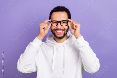 Photo of young toothy beaming smile hispanic guy wear white pullover new glasses spectacles best vision isolated on violet color background