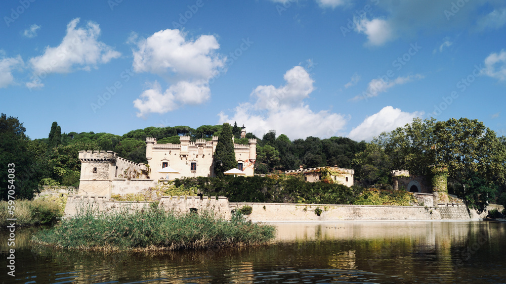 Lake with castle in the background in the nature. Jal pi castle in Arenys de munt, 20th century, located in the Maresme region. Tourist sites near Barcelona.