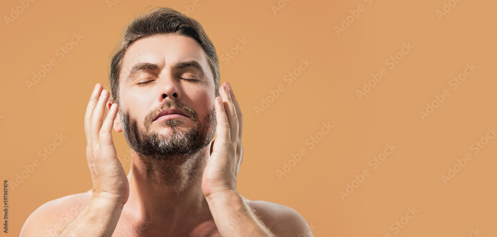 Fototapeta premium Beautiful man with clean perfect skin. Beauty male skin care. Cosmetology cosmetics beauty and spa. Male facial treatment and wellness. Banner for header, copy space. Poster for web design.