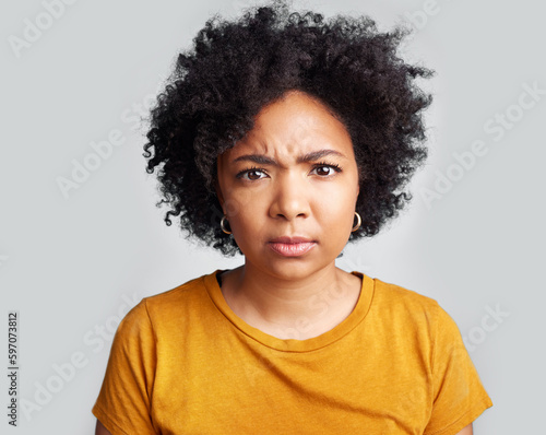 Confused, portrait and woman in studio, pensive and unsure against a grey background. Doubt, annoyed and face of African female with dont know frown, attitude and angry, doubtful and frustrated