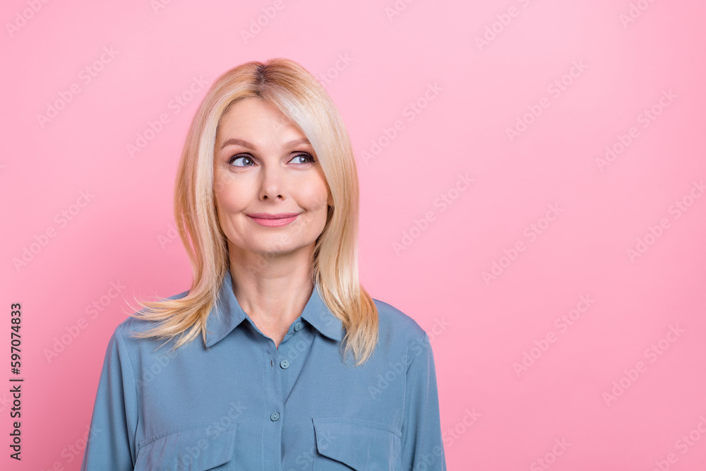 Photo of charming retired broker lady look interested promo banner empty space wear office shirt isolated pink color background Photo of charming retired broker lady look interested promo banner empty space wear office shirt isolated pink color background