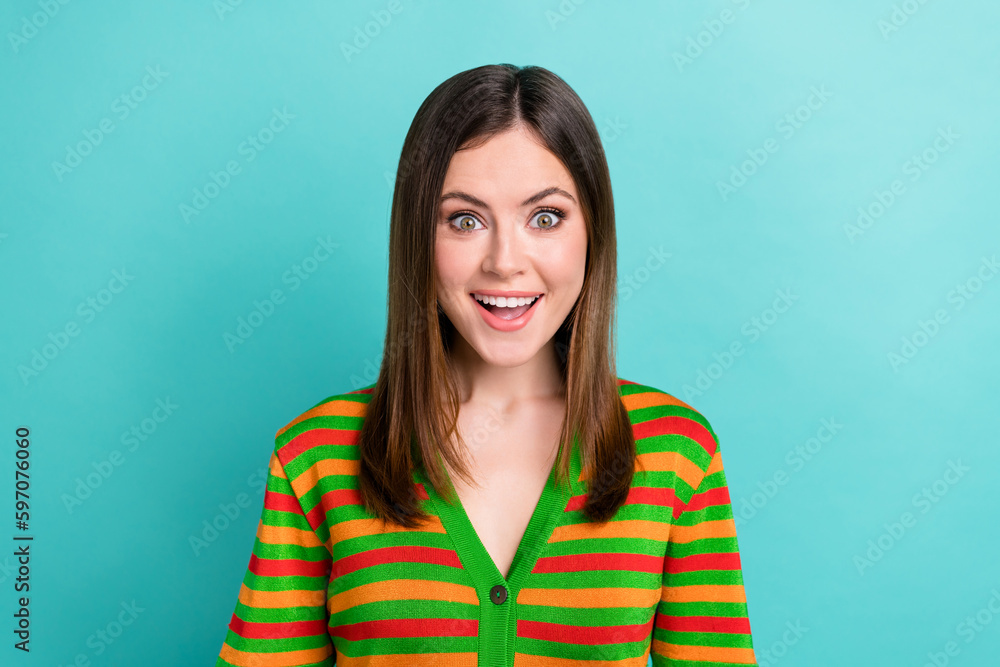 Photo of excited funky lady wear striped cardigan smiling open mouth isolated turquoise color background Photo of excited funky lady wear striped cardigan smiling open mouth isolated turquoise color background