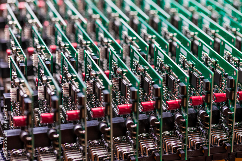 Fototapeta premium Electronic Production Ideas. Closeup View of Batch of Ready Automotive Printed Circuit Boards with Surface Mounted Components.