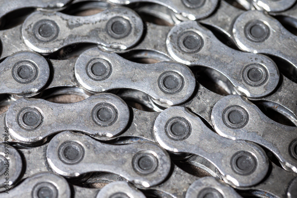 Extreme Closeup View of Used Dirty Greasy Oiled Bicycle Chain As A Part of Metal Bicycle Equipment On Stony Background With Contrast Details Extreme Closeup View of Used Dirty Greasy Oiled Bicycle Chain As A Part of Metal Bicycle Equipment On Stony Background With Contrast Details