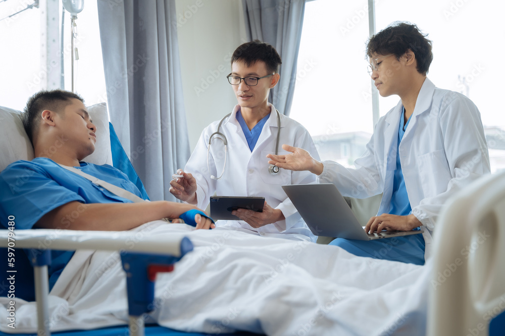 Accident, health and people concept. Doctor talking to male patient on hospital bed. Accident, health and people concept. Doctor talking to male patient on hospital bed.