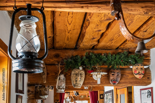 Snowfall in Sauris. Among the woods and historic houses. photo