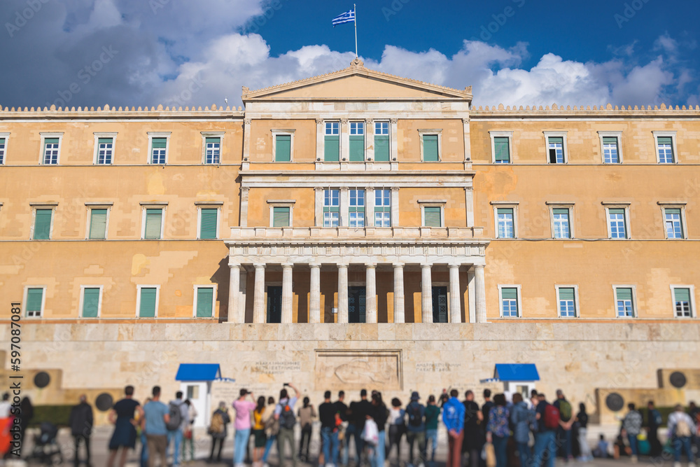 Obraz premium Greek Parliament in Old Royal Palace building facade exterior, Hellenic Bouleterion parliament house on Syntagma square, Athens, Attica, Greece in a summer day