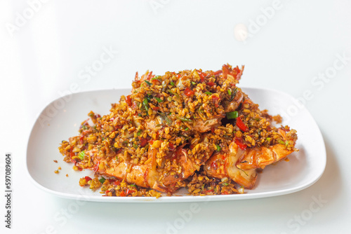 Stir Fried Prawn with Chili and Salt It is Thai Asian food with a mellow spicy taste as seafood in a white plate.