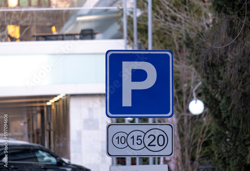 Parking sign and auxiliary information sign at the entrance to the parking area of vehicles.