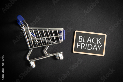 Shopping cart on the black background. Black Friday