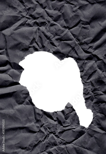 Hole in black crumpled wrinkled paper texture