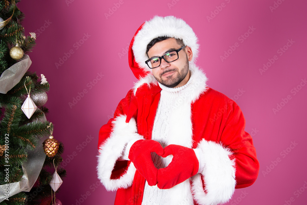 Young attractive student on a holiday dressed as Santa Claus Young attractive student on a holiday dressed as Santa Claus