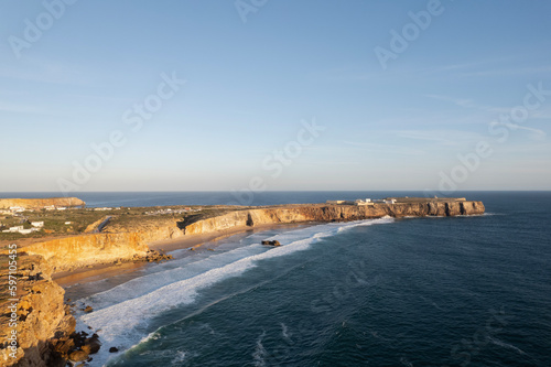 drone landscape view of sunset over the sea in sagres in algarve portugal 